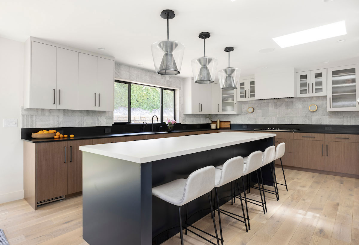 Modern bungalow kitchen with bar seating area.