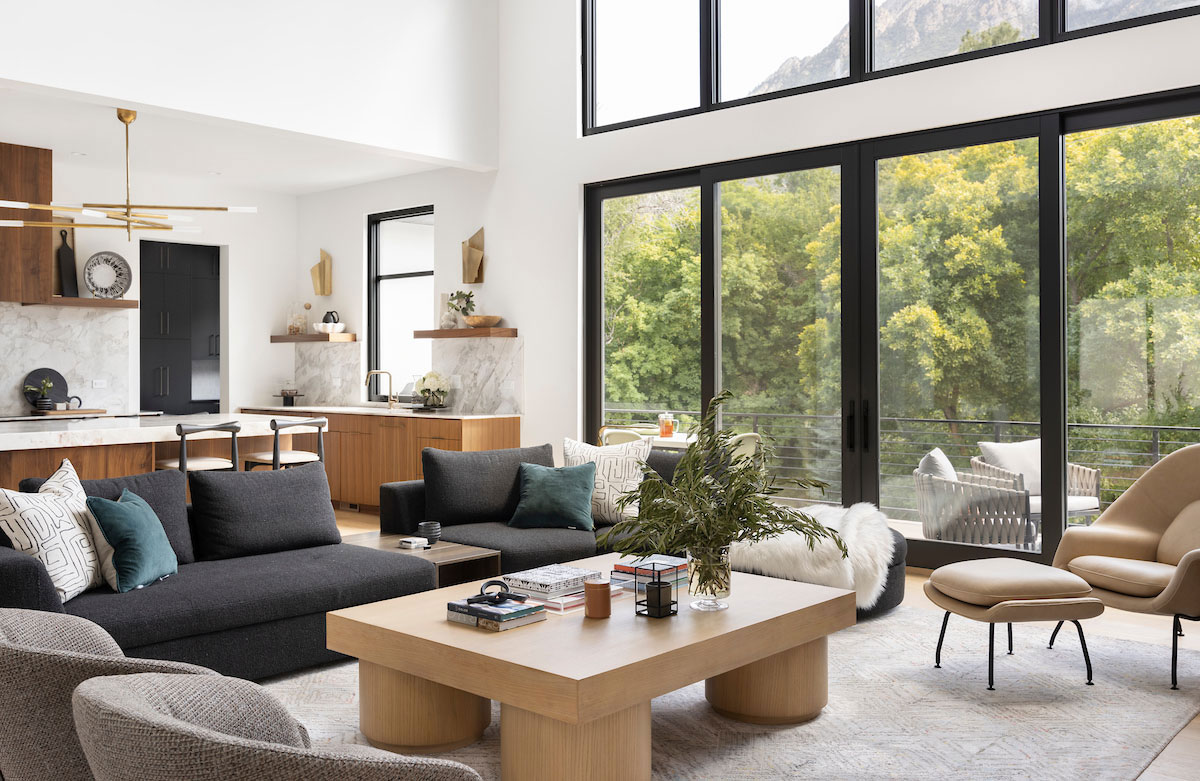 Modern remodeled living space with large windows.